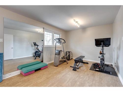 1428 Chardie Place Sw, Calgary, AB - Indoor Photo Showing Gym Room