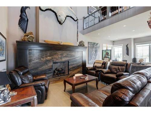 9 Swift Creek Green, Rural Rocky View County, AB - Indoor Photo Showing Living Room With Fireplace