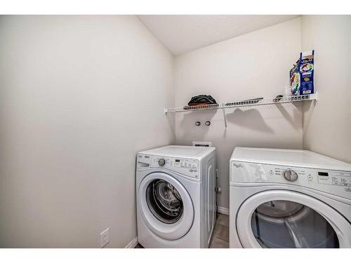 15 Savanna Parade Ne, Calgary, AB - Indoor Photo Showing Laundry Room