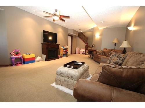 339 Sagewood Place Sw, Airdrie, AB - Indoor Photo Showing Living Room With Fireplace