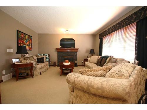 339 Sagewood Place Sw, Airdrie, AB - Indoor Photo Showing Living Room With Fireplace
