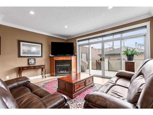 110 21 Avenue Ne, Calgary, AB - Indoor Photo Showing Living Room With Fireplace