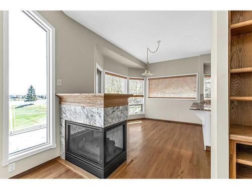 197 Lakeside Greens Drive, Chestermere, AB - Indoor Photo Showing Other Room With Fireplace