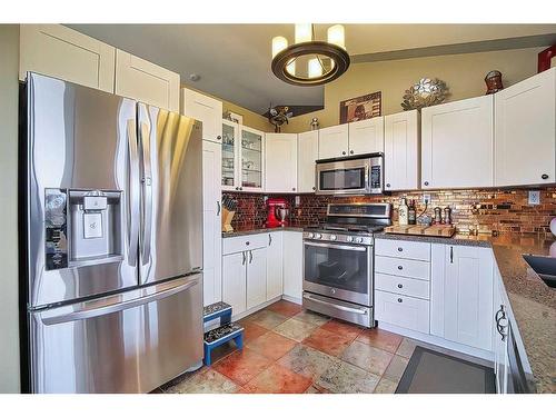 272011 Range Road 275, Rural Rocky View County, AB - Indoor Photo Showing Kitchen With Stainless Steel Kitchen With Double Sink