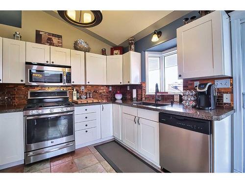 272011 Range Road 275, Rural Rocky View County, AB - Indoor Photo Showing Kitchen With Stainless Steel Kitchen With Double Sink