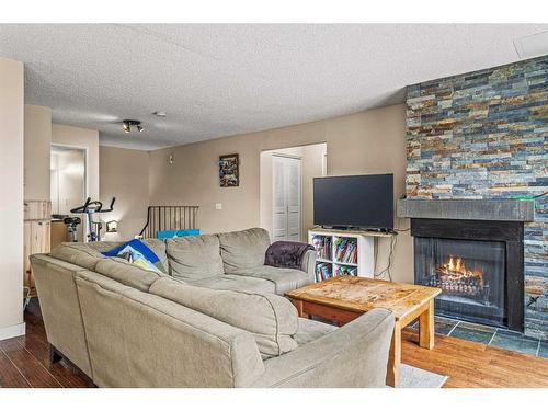 102-436 Banff Avenue, Banff, AB - Indoor Photo Showing Living Room With Fireplace