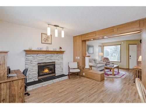 105 Arbour Ridge Circle Nw, Calgary, AB - Indoor Photo Showing Living Room With Fireplace