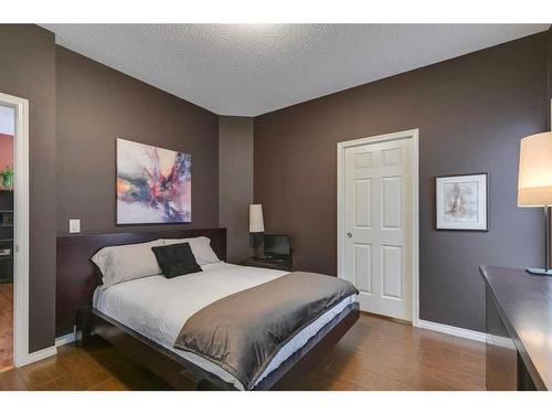 221 Sunset Heights, Cochrane, AB - Indoor Photo Showing Bedroom