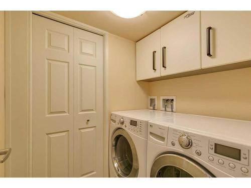 221 Sunset Heights, Cochrane, AB - Indoor Photo Showing Laundry Room