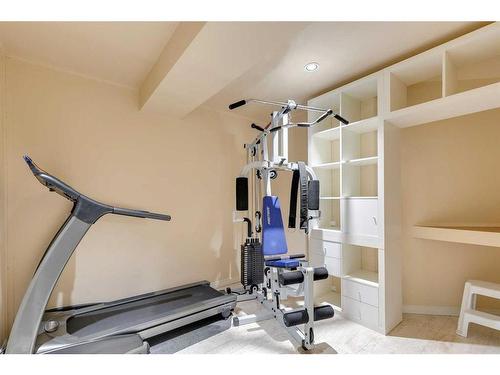 221 Sunset Heights, Cochrane, AB - Indoor Photo Showing Gym Room