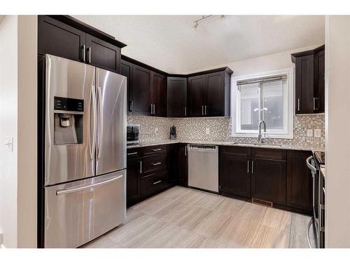 60 Martinglen Mews Ne, Calgary, AB - Indoor Photo Showing Kitchen With Stainless Steel Kitchen With Upgraded Kitchen
