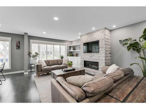 3240 Alfege Street Sw, Calgary, AB - Indoor Photo Showing Living Room With Fireplace