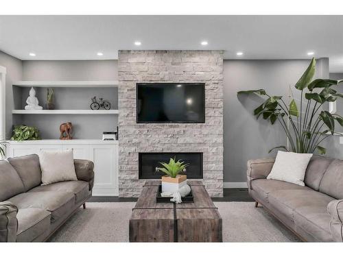 3240 Alfege Street Sw, Calgary, AB - Indoor Photo Showing Living Room With Fireplace