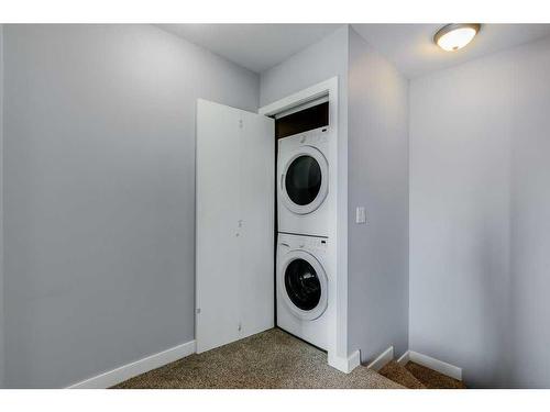 208-50 Westland Road, Okotoks, AB - Indoor Photo Showing Laundry Room