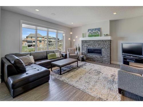 89 Rockcliff Heights Nw, Calgary, AB - Indoor Photo Showing Living Room With Fireplace
