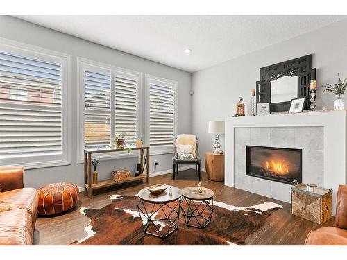 203 Bayview Circle Sw, Airdrie, AB - Indoor Photo Showing Living Room With Fireplace