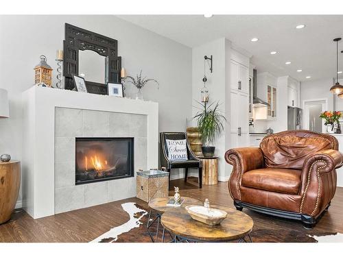 203 Bayview Circle Sw, Airdrie, AB - Indoor Photo Showing Living Room With Fireplace