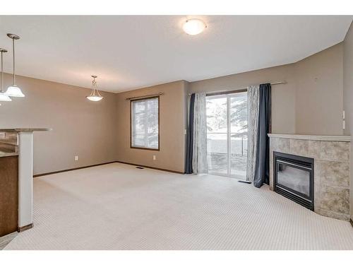 138 Eversyde Common Sw, Calgary, AB - Indoor With Fireplace