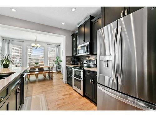 234 Mountainview Drive Nw, Okotoks, AB - Indoor Photo Showing Kitchen With Upgraded Kitchen