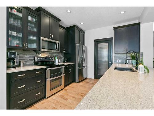 234 Mountainview Drive Nw, Okotoks, AB - Indoor Photo Showing Kitchen With Upgraded Kitchen