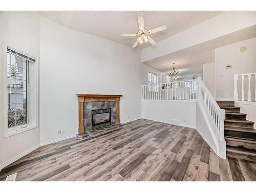 4 West Hall Place, Cochrane, AB - Indoor With Fireplace