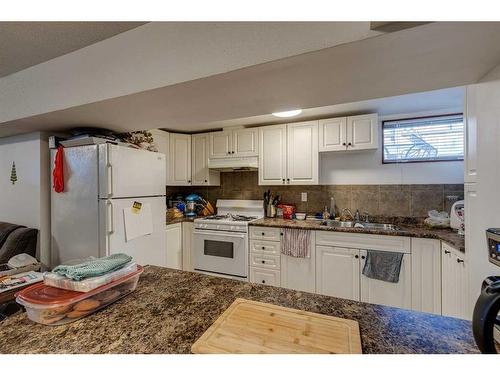 112 Pennsburg Way Se, Calgary, AB - Indoor Photo Showing Kitchen With Double Sink