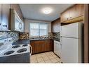 112 Pennsburg Way Se, Calgary, AB  - Indoor Photo Showing Kitchen With Double Sink 
