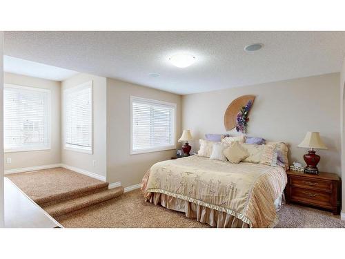 204 Westland Street, Okotoks, AB - Indoor Photo Showing Bedroom