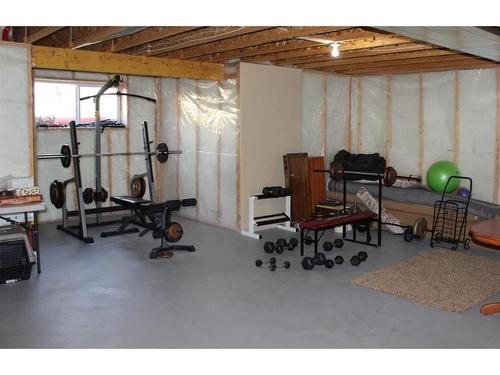 204 Westland Street, Okotoks, AB - Indoor Photo Showing Gym Room