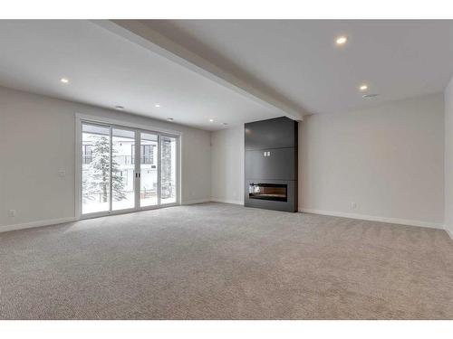 468 Discovery Place Sw, Calgary, AB - Indoor With Fireplace