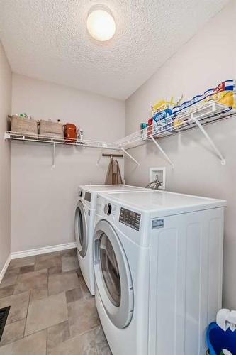 66 Prestwick Landing Se, Calgary, AB - Indoor Photo Showing Laundry Room