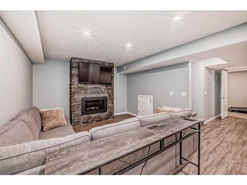 66 Prestwick Landing Se, Calgary, AB - Indoor With Fireplace