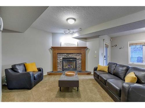 19 Elgin Estates Hill Se, Calgary, AB - Indoor Photo Showing Living Room With Fireplace