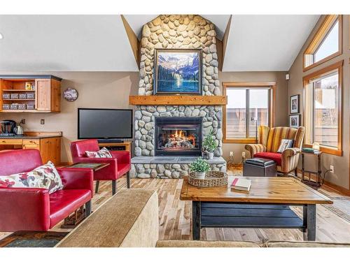 262B Three Sisters Drive, Canmore, AB - Indoor Photo Showing Living Room With Fireplace