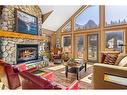 262B Three Sisters Drive, Canmore, AB  - Indoor Photo Showing Living Room With Fireplace 
