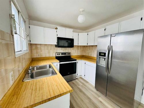 352 Falshire Way Ne, Calgary, AB - Indoor Photo Showing Kitchen With Stainless Steel Kitchen With Double Sink