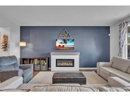 194 Chaparral Valley Square Se, Calgary, AB - Indoor Photo Showing Living Room With Fireplace