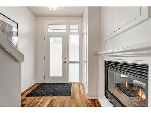 102-660 Eau Claire Avenue Sw, Calgary, AB - Indoor With Fireplace