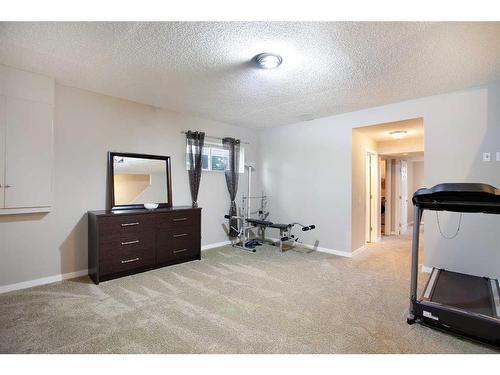 1126 New Brighton Park Se, Calgary, AB - Indoor Photo Showing Gym Room