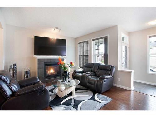 1126 New Brighton Park Se, Calgary, AB - Indoor Photo Showing Living Room With Fireplace