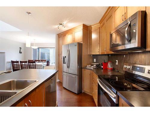 1126 New Brighton Park Se, Calgary, AB - Indoor Photo Showing Kitchen With Double Sink