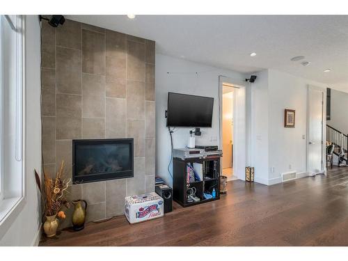 5228 Bowness Road Nw, Calgary, AB - Indoor Photo Showing Living Room With Fireplace