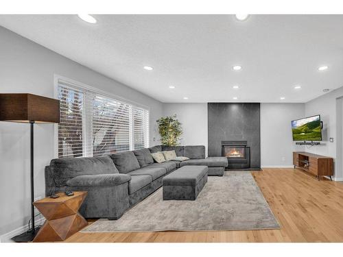 158 Shawbrooke Green Sw, Calgary, AB - Indoor Photo Showing Living Room With Fireplace