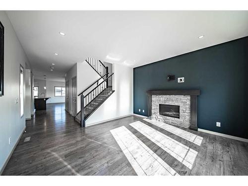 449 Marquis Heights Se, Calgary, AB - Indoor Photo Showing Living Room With Fireplace