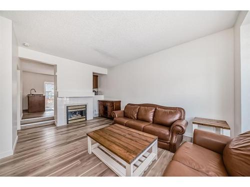 48 Shawbrooke Court Sw, Calgary, AB - Indoor Photo Showing Living Room With Fireplace
