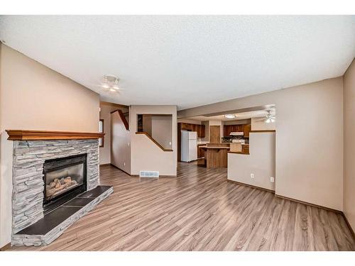 118 Somercrest Gardens Sw, Calgary, AB - Indoor Photo Showing Living Room With Fireplace
