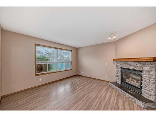 118 Somercrest Gardens Sw, Calgary, AB - Indoor Photo Showing Living Room With Fireplace