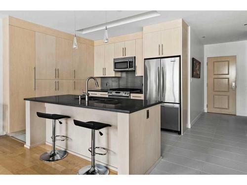 305-701 3 Avenue Sw, Calgary, AB - Indoor Photo Showing Kitchen With Stainless Steel Kitchen With Double Sink