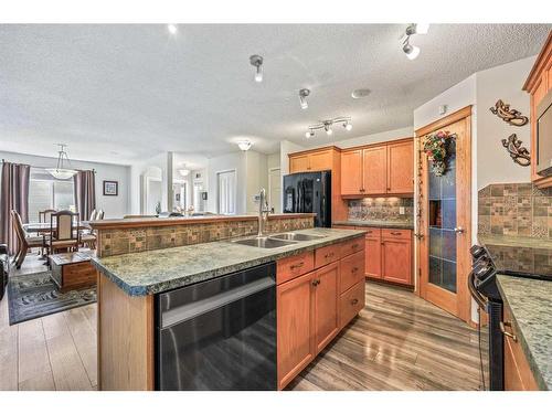 523 Stonegate Way Nw, Airdrie, AB - Indoor Photo Showing Kitchen With Double Sink