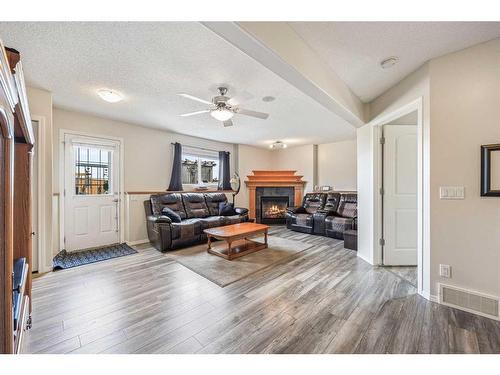 523 Stonegate Way Nw, Airdrie, AB - Indoor Photo Showing Other Room With Fireplace